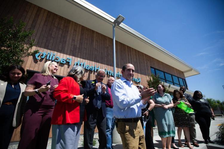 Supervisor Jeff Flores standing with others in front of one of the new Kern County Behavioral and Recovery Services facilities